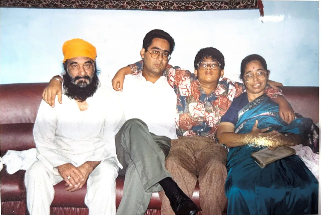 Dada ji and Dadi ji on a sofa with family