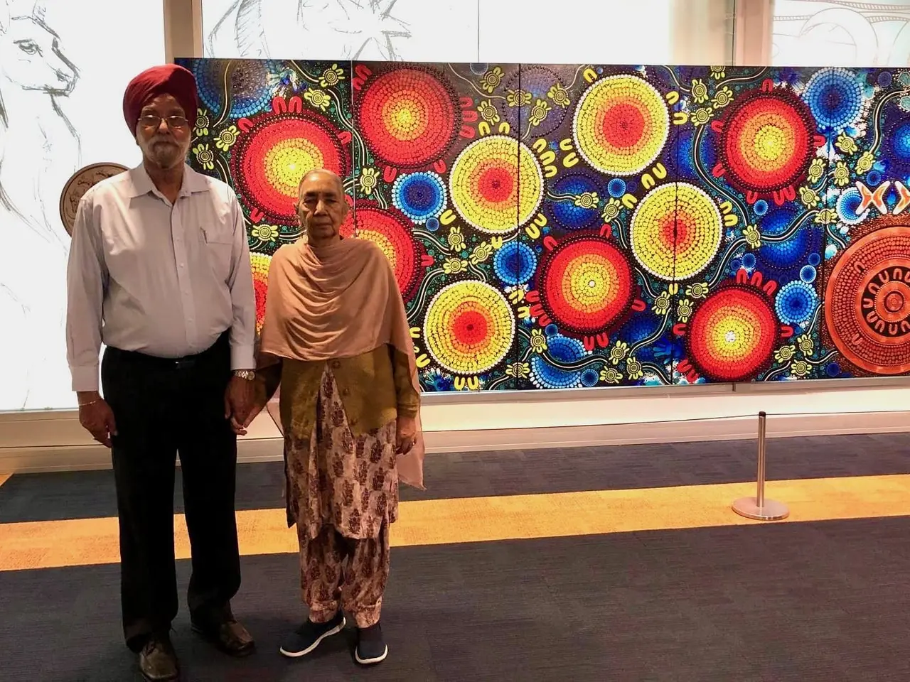 Nanu and Nani standing in front of a colourful mural
