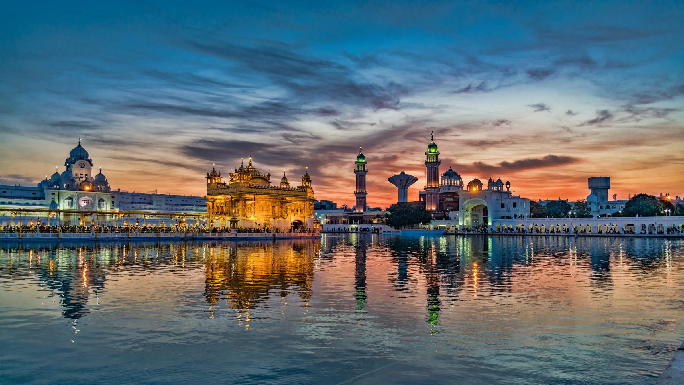 Sri Harmandir Sahib at dusk, reflected in the sarovar